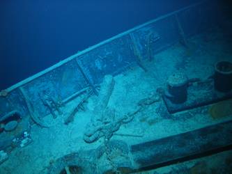 Shank of stbd anchor pulled up through hawse pipe